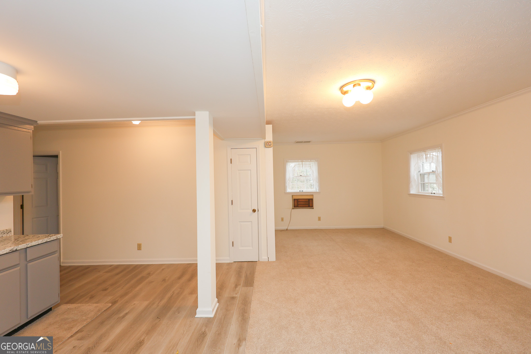 207 North View Pointe Drive LaGrange, GA 30241 - Photo 35 of 55 an empty room with wooden floor and windows