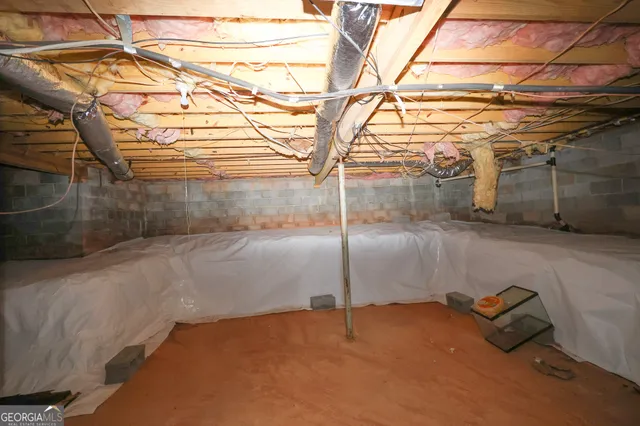 a view of a yard with trees in front of it