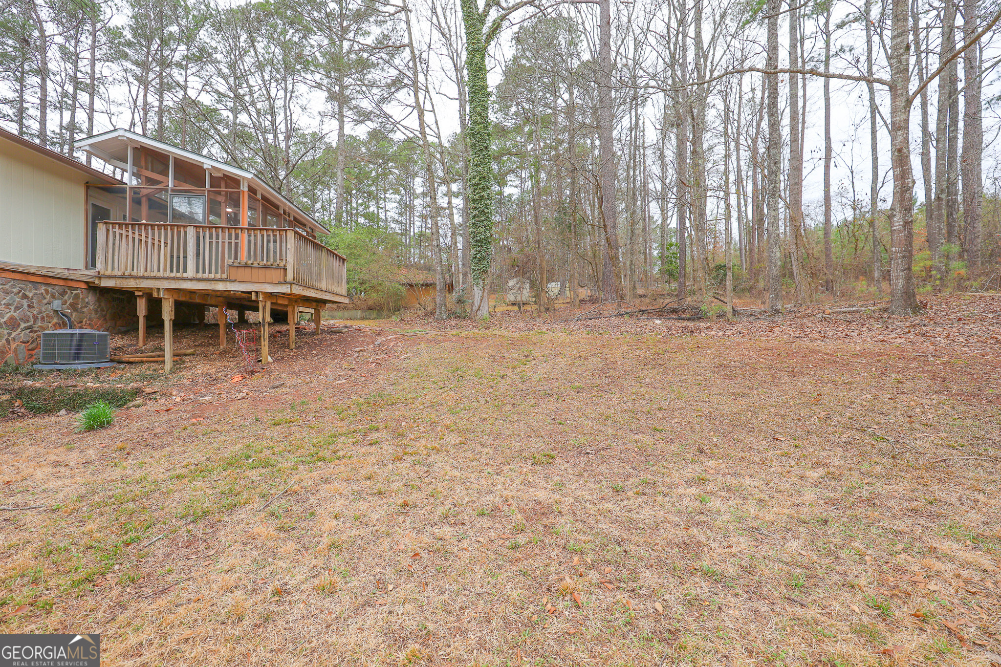 207 North View Pointe Drive LaGrange, GA 30241 - Photo 58 of 74 a view of a house with a yard tree and wooden fence