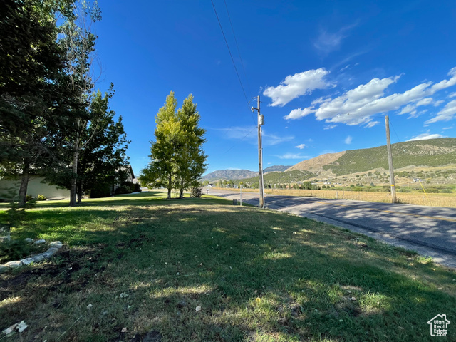 11473 South Dempsey Creek Road Lava Hot Springs, ID 83246 - Photo 4 of 47 View of home's community featuring a mountain view and a yard