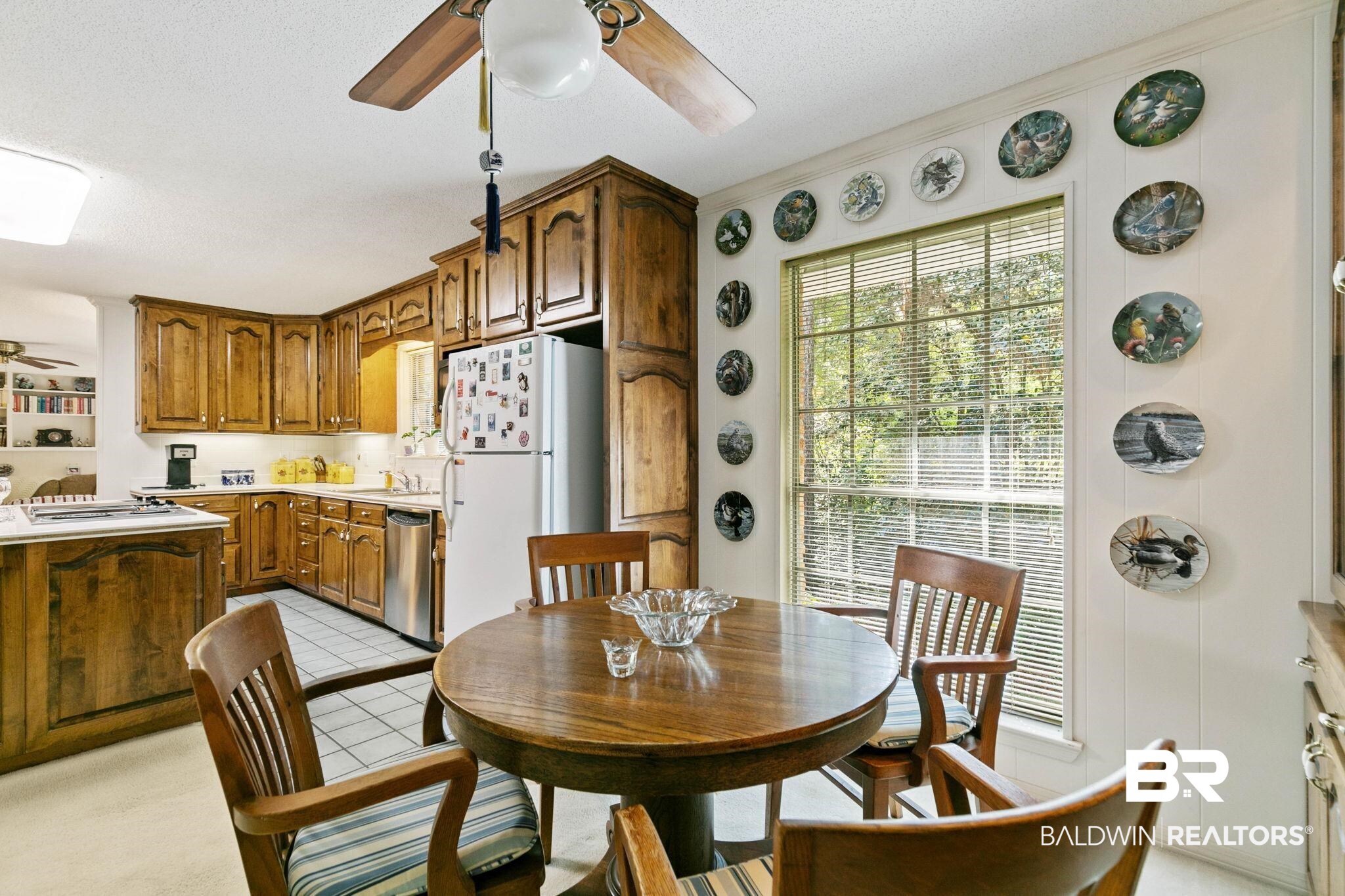 752 Evergreen Street Fairhope, AL 36532 - Photo 16 of 100 Dining space with a ceiling fan, light tile patterned flooring, and a textured ceiling