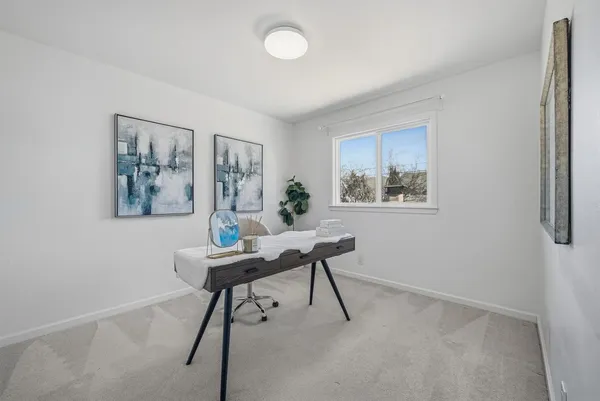 a workspace with furniture and a window