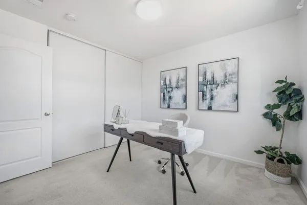 a view of a workspace with furniture
