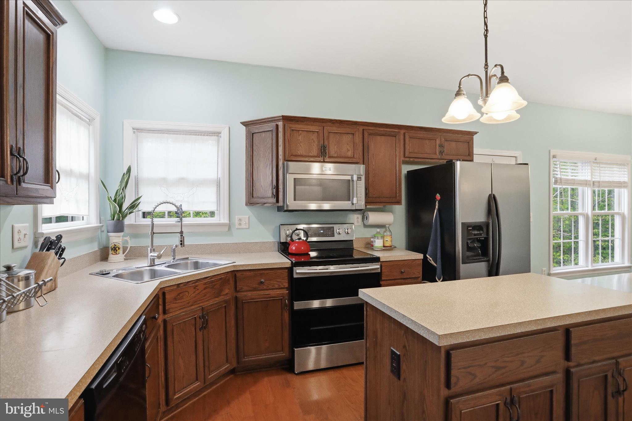 1175 North Lakewood Drive Ridgeley, WV 26753 - Photo 8 of 33 a kitchen with granite countertop a sink stainless steel appliances and cabinets