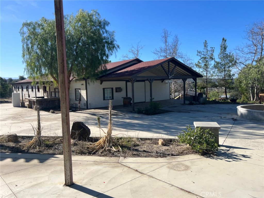 37220 Quarter Valley Road Temecula, CA 92592 - Photo 13 of 24 a front view of a house with garden