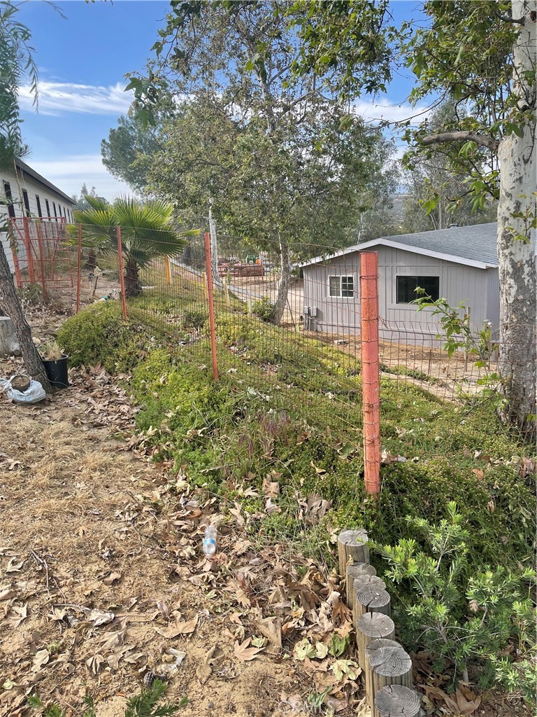 37220 Quarter Valley Road Temecula, CA 92592 - Photo 3 of 12 a view of a small yard in front of house