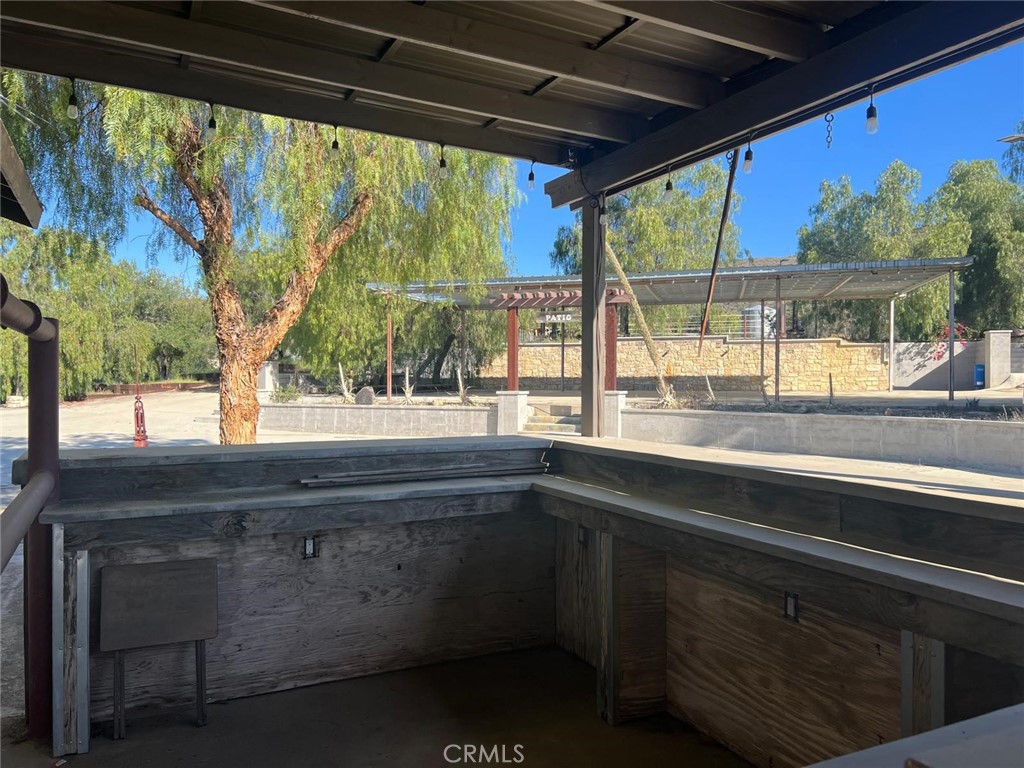 37220 Quarter Valley Road Temecula, CA 92592 - Photo 5 of 24 a kitchen sink with a stove and garden view