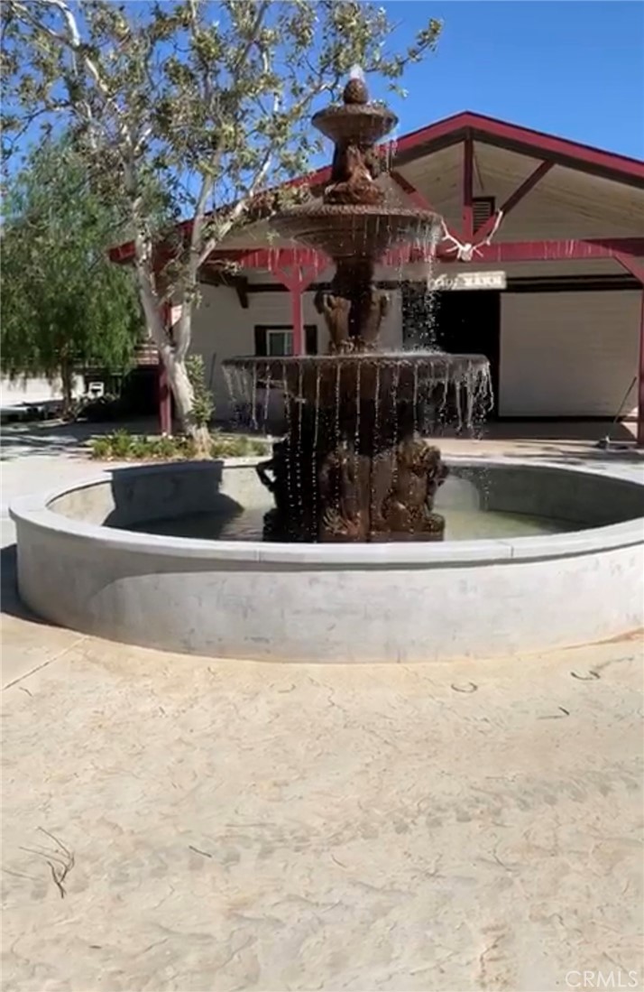 37220 Quarter Valley Road Temecula, CA 92592 - Photo 7 of 12 a view of a building with a patio
