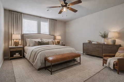 a bedroom with a bed and ceiling fan