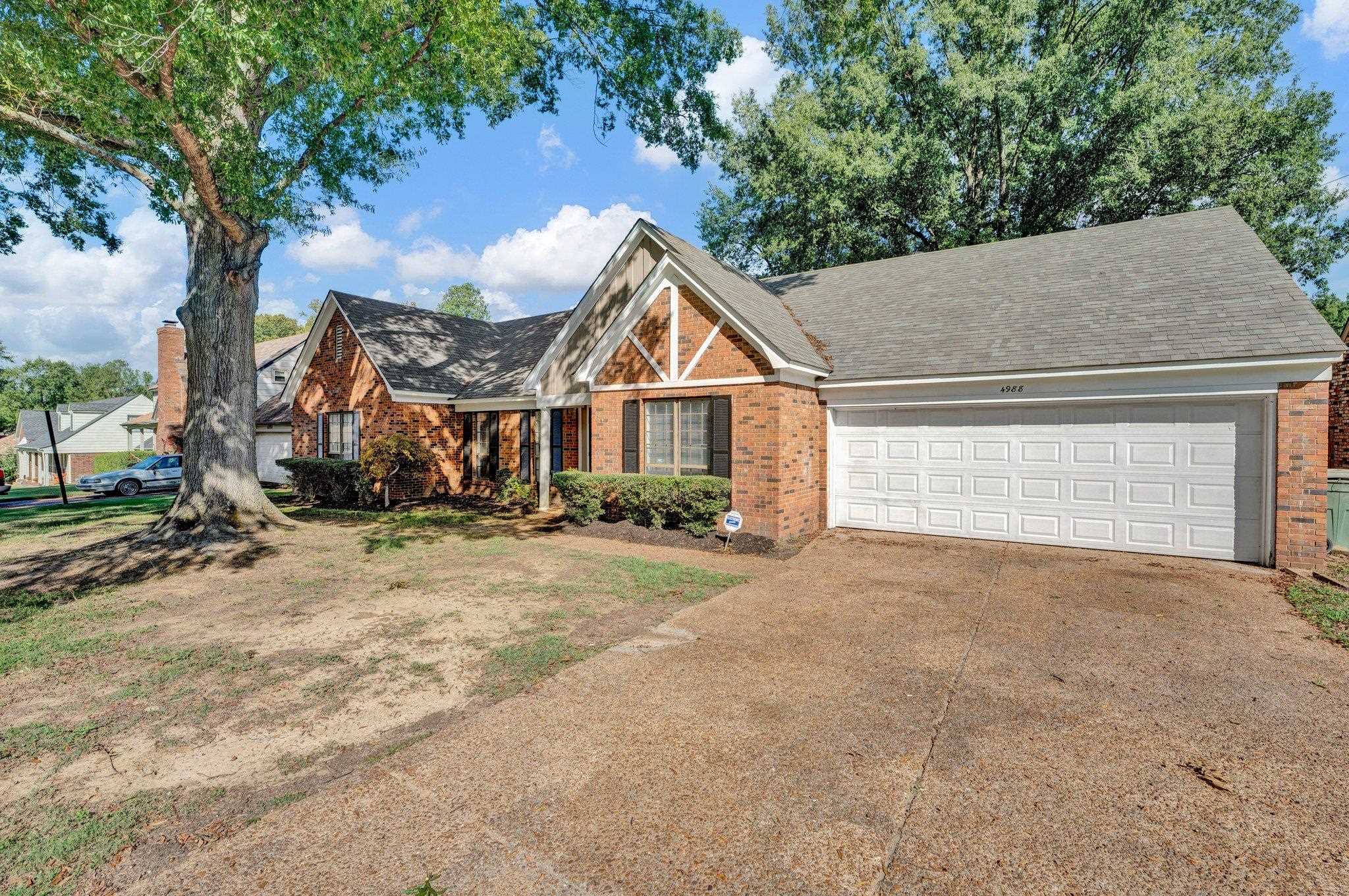 4988 Ridge Tree Drive Memphis, TN 38128 - Photo 1 of 22 a view of a house with a yard and garage
