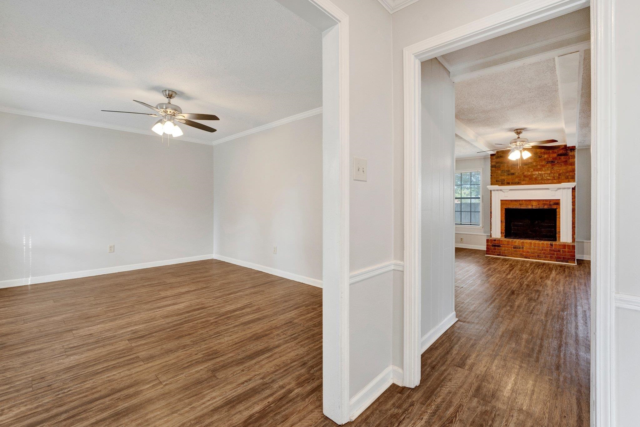 4988 Ridge Tree Drive Memphis, TN 38128 - Photo 3 of 22 wooden floor in an empty room with a window