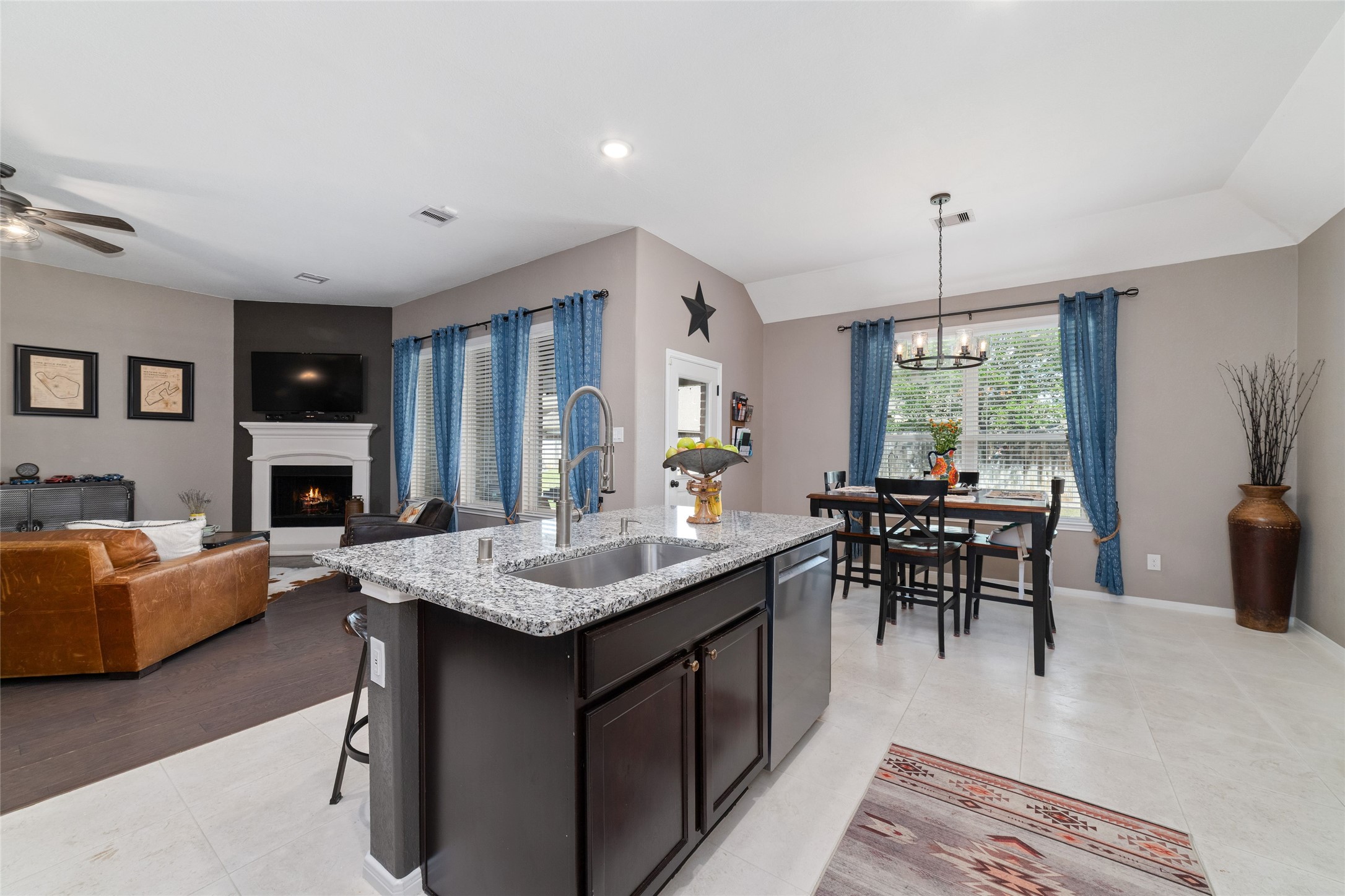 9902 Indian Rill Court Tomball, TX 77375 - Photo 10 of 34 Functional and large kitchen with granite countertops and stainless steel appliances, including a double oven! Gas burner cooktop. Eat-in kitchen island with sink. Large walk-in pantry. Tons of storage & usable counter space!