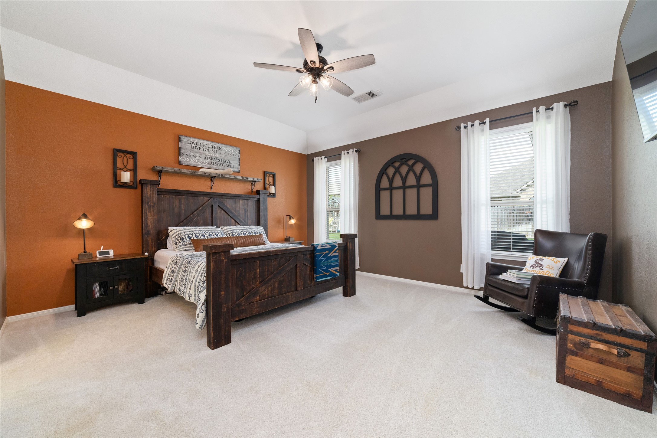 9902 Indian Rill Court Tomball, TX 77375 - Photo 13 of 34 Expansive primary suite with upgraded luxury carpet. Enough room for a king size bed, night stands, and separate seating area. Views of your private backyard.