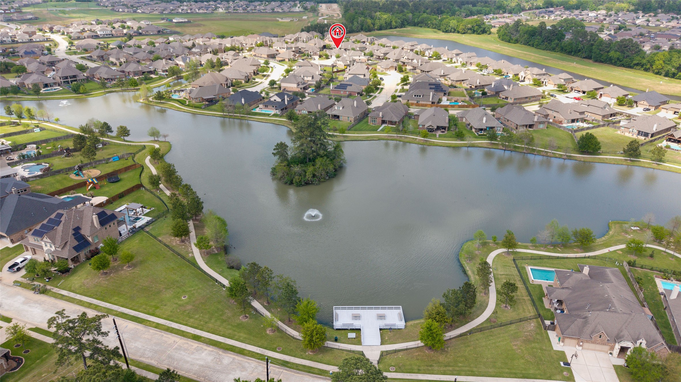 9902 Indian Rill Court Tomball, TX 77375 - Photo 31 of 34 The neighborhood lake offers a fishing pier, picnic tables, and trails.