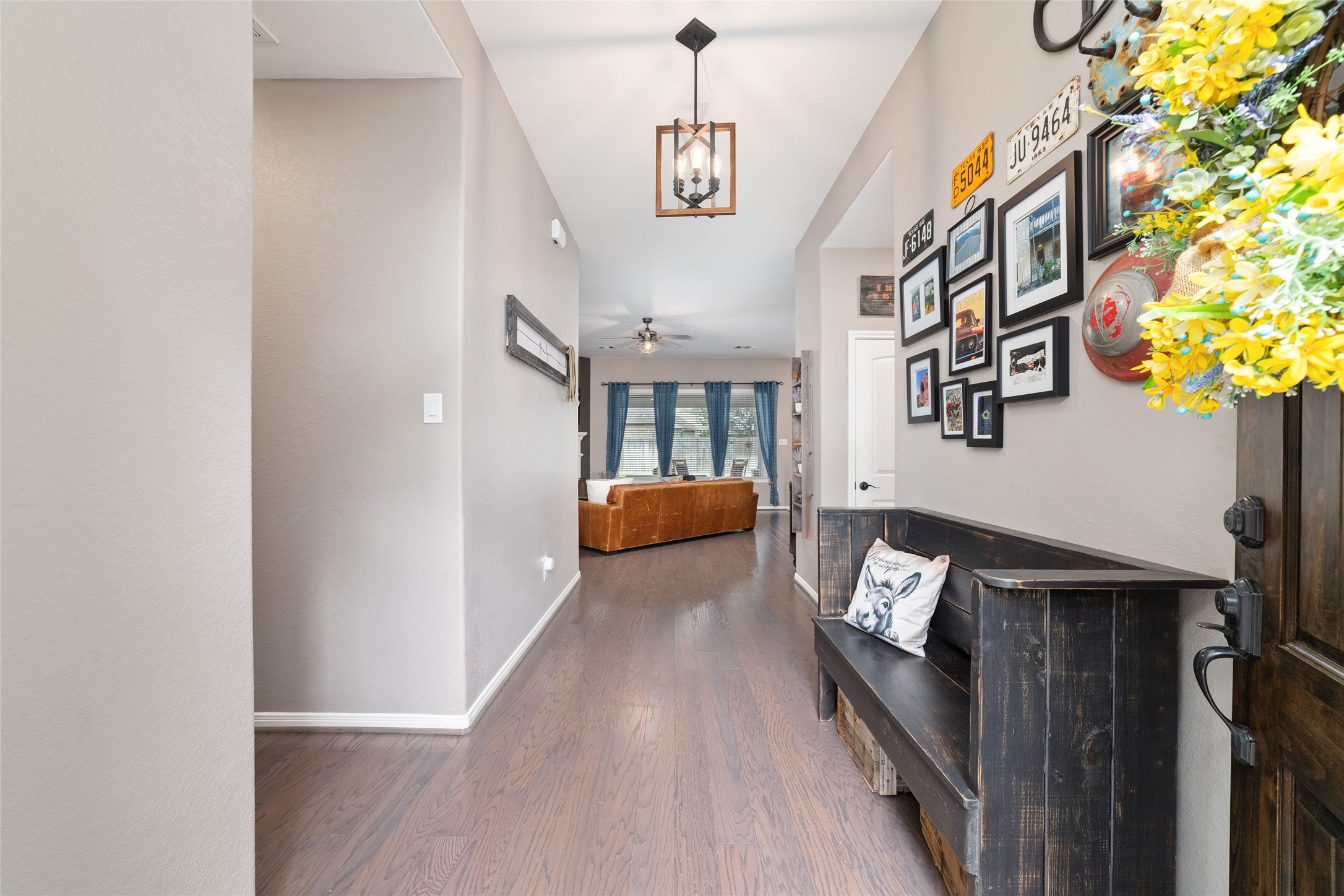 9902 Indian Rill Court Tomball, TX 77375 - Photo 4 of 34 Wide entryway with a direct view of your private backyard ahead. Updated engineered hardwood flooring. All new light fixtured throughout.