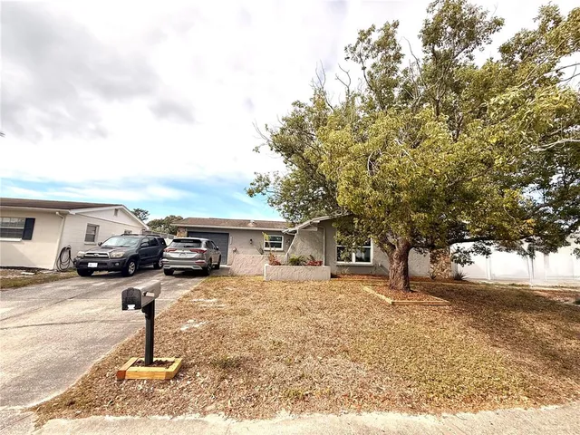 a view of a backyard with a car parked in it