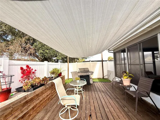 a view of a backyard with seating area