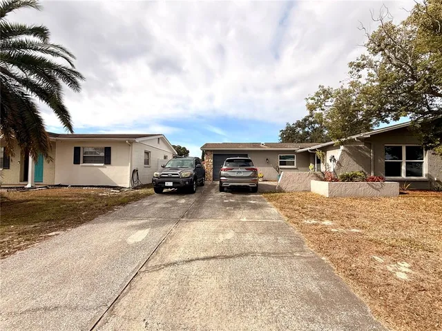 a front view of a house with seating space