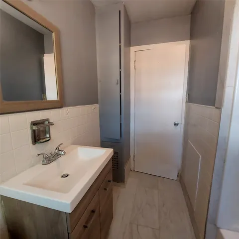 a bathroom with a sink a mirror and a toilet