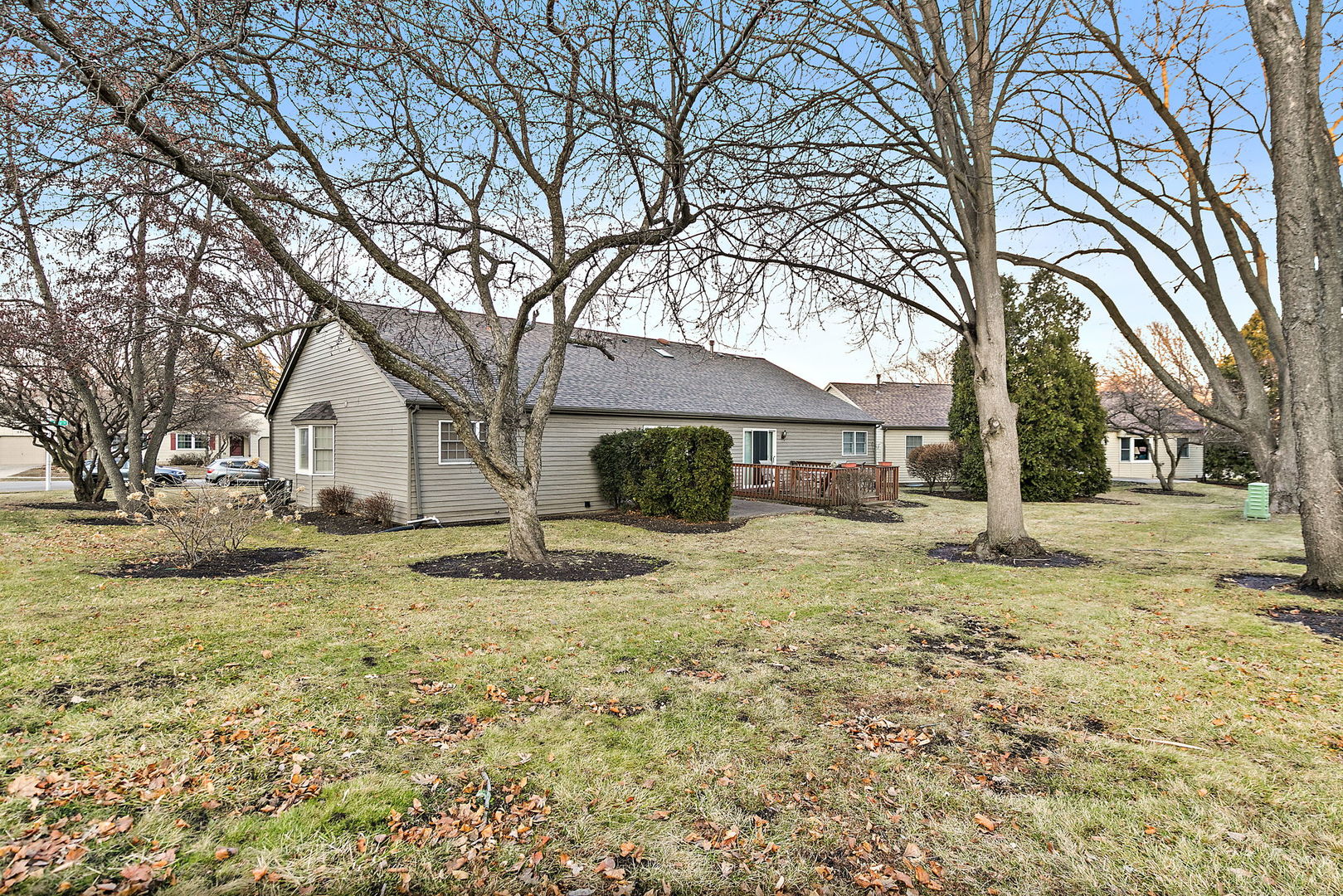 682 Alice Place, Unit 682 Elgin, IL 60123 - Photo 18 of 18 a white house that has a tree in front of it