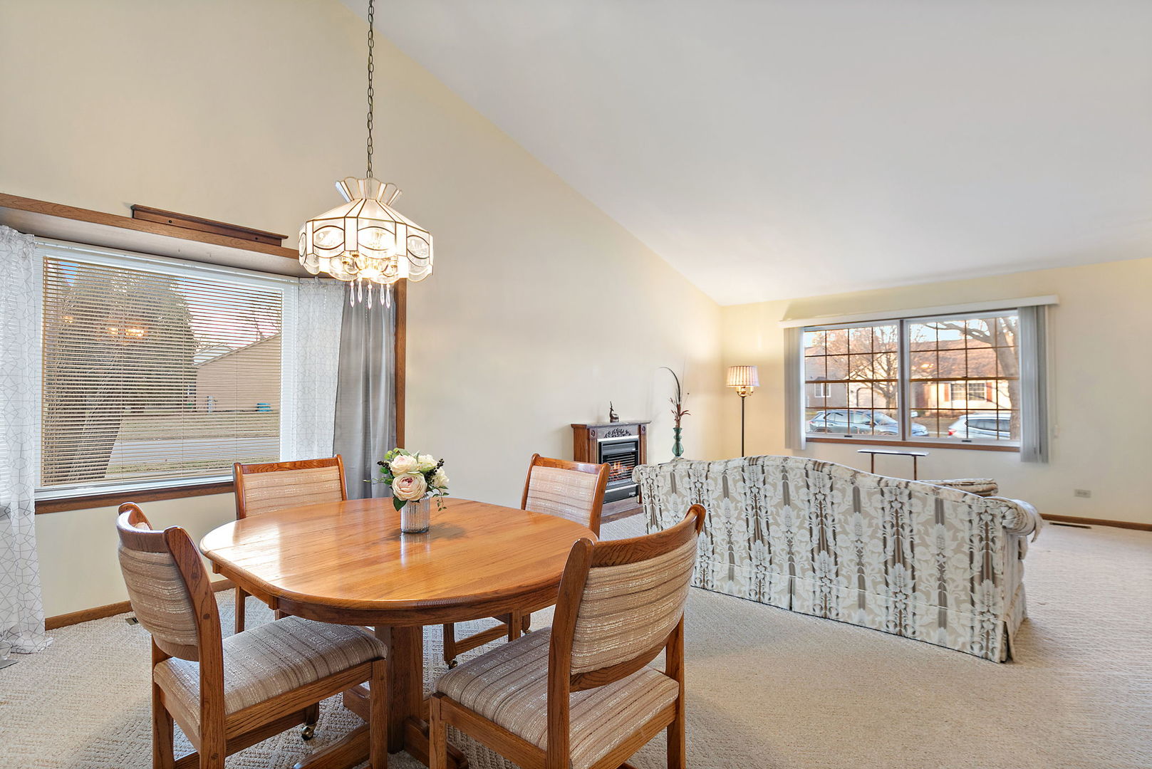 682 Alice Place, Unit 682 Elgin, IL 60123 - Photo 6 of 18 a view of a dining room with furniture wooden floor and chandelier