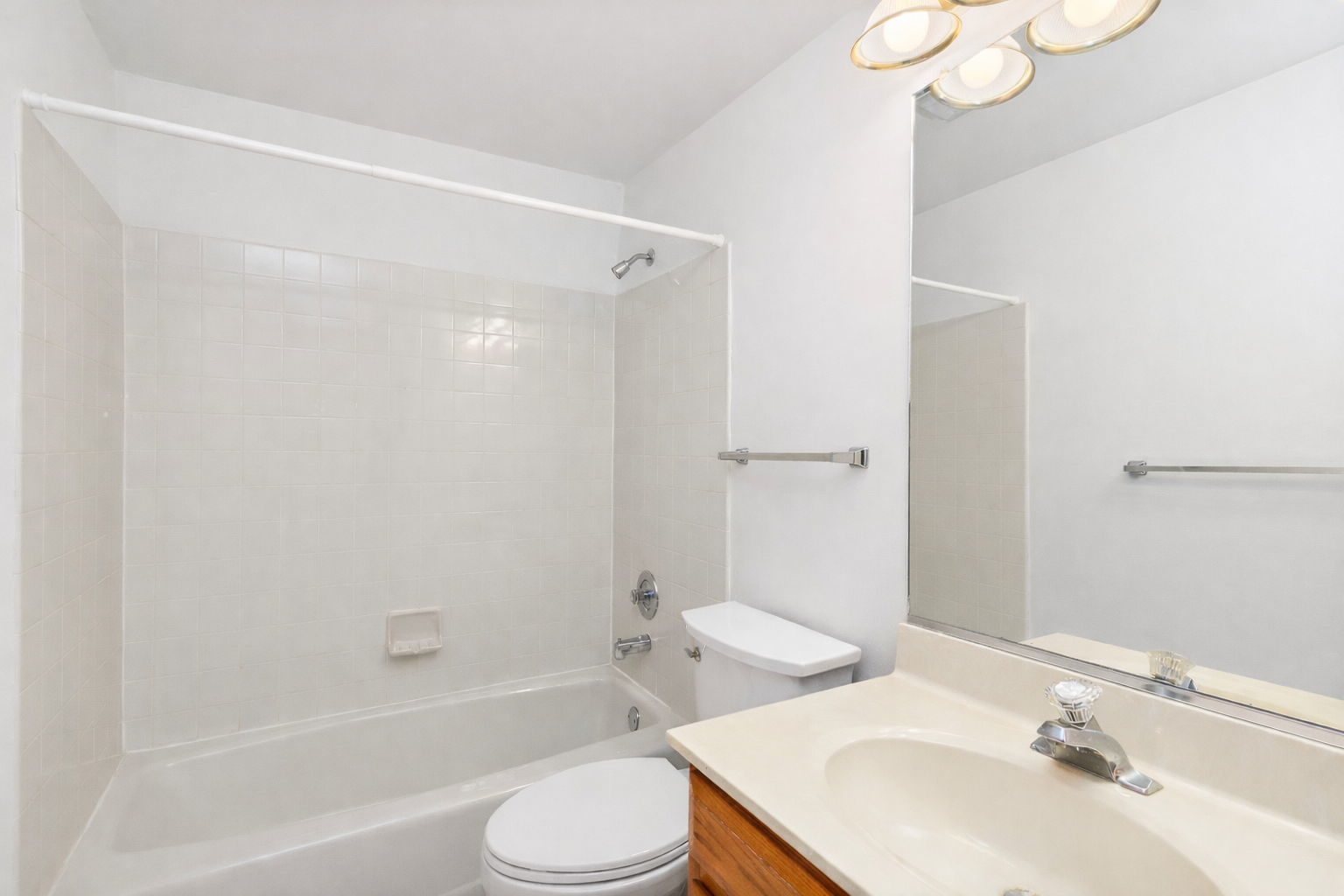 682 Alice Place, Unit 682 Elgin, IL 60123 - Photo 10 of 18 a bathroom with a sink toilet and shower