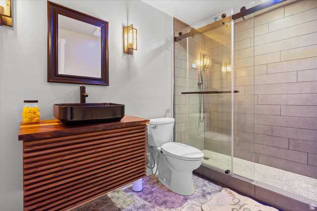 3359 Eurasian Crane Road Clinton, UT 84015 - Photo 55 of 71 Bathroom featuring a stall shower and vanity