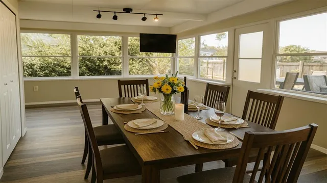 a view of a dining room with furniture window and outside view