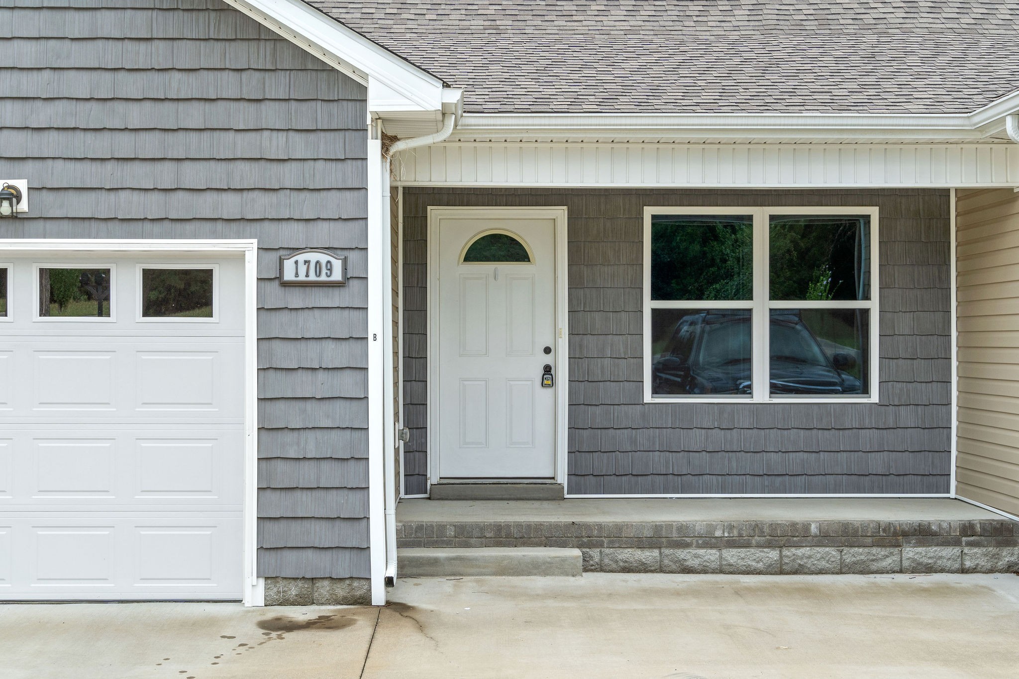 a front view of a house with a empty space