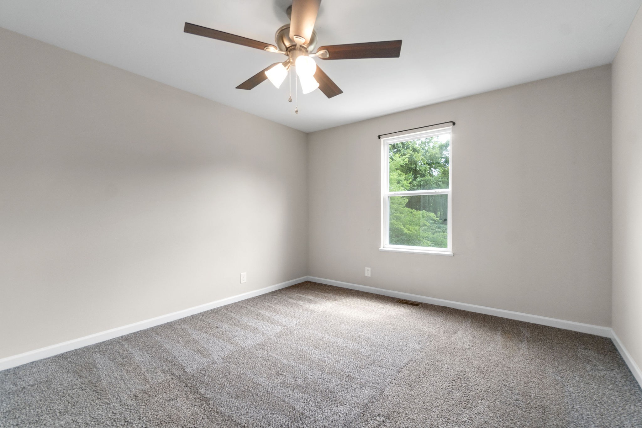 1709 Evans Road, Unit B Clarksville, TN 37042 - Photo 16 of 24 an empty room with windows and ceiling fan
