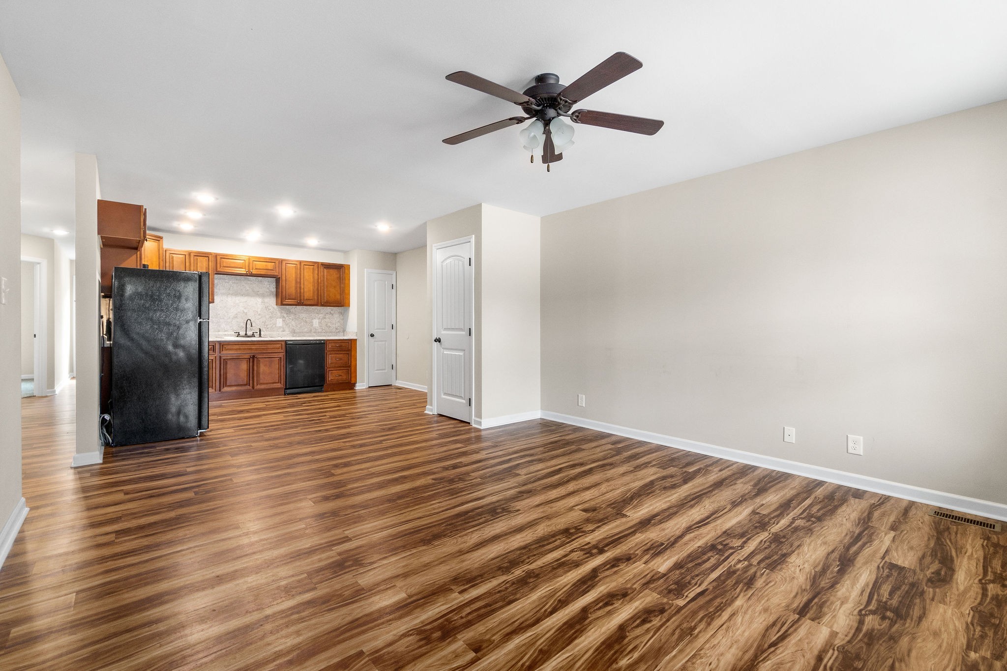 1709 Evans Road, Unit B Clarksville, TN 37042 - Photo 6 of 24 a view of empty room with wooden floor and a ceiling fan