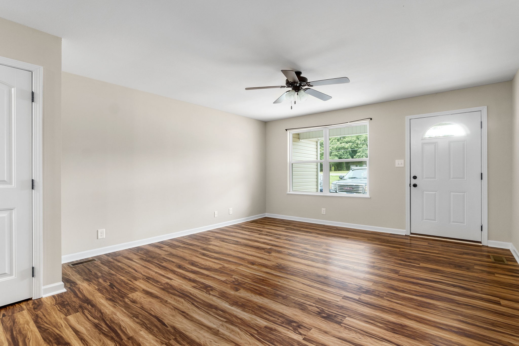 1709 Evans Road, Unit B Clarksville, TN 37042 - Photo 7 of 24 a view of empty room with wooden floor and fan
