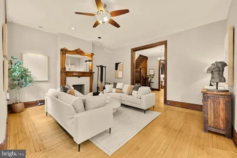 a kitchen view with granite countertop a refrigerator and a sink