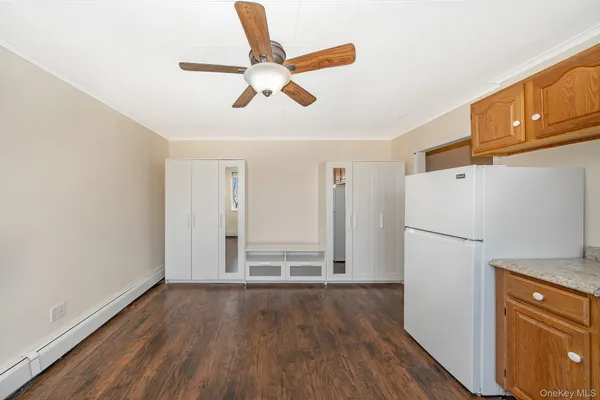 a view of a livingroom with wooden floor
