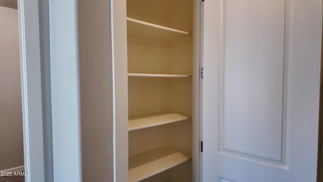 a view of a bathroom from a hallway