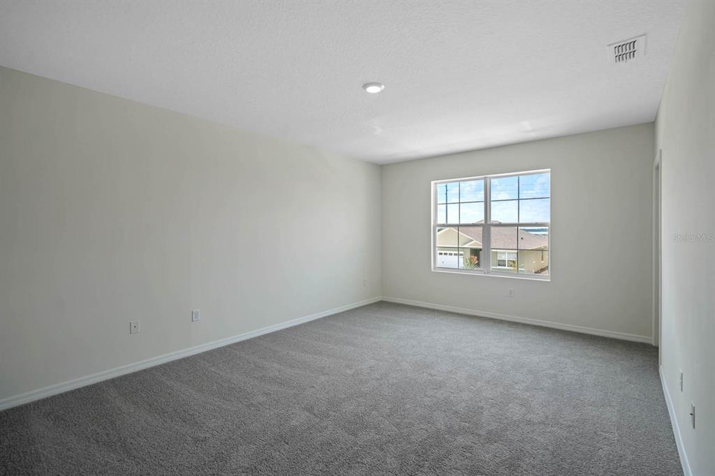1217 Alstonia Mount Mount Dora, FL 32757 - Photo 18 of 33 an empty room with windows