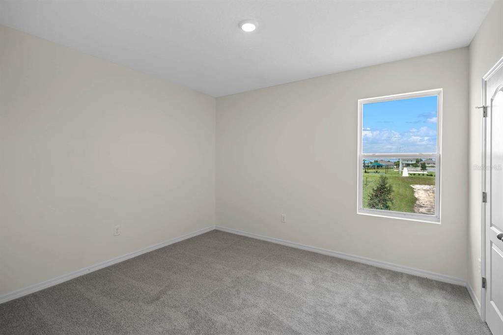 1217 Alstonia Mount Mount Dora, FL 32757 - Photo 25 of 33 an empty room with windows