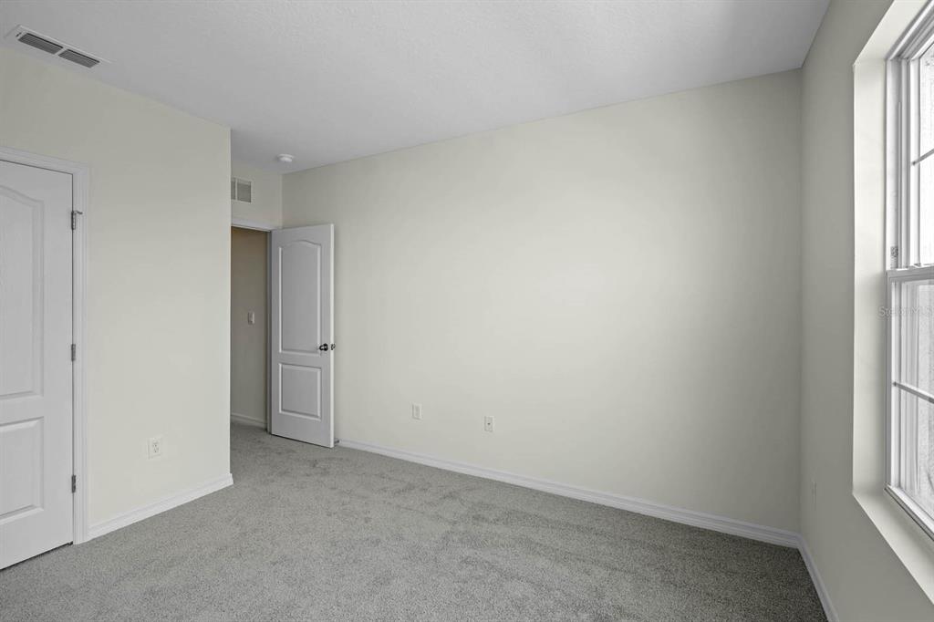 1217 Alstonia Mount Mount Dora, FL 32757 - Photo 32 of 33 an empty room with windows
