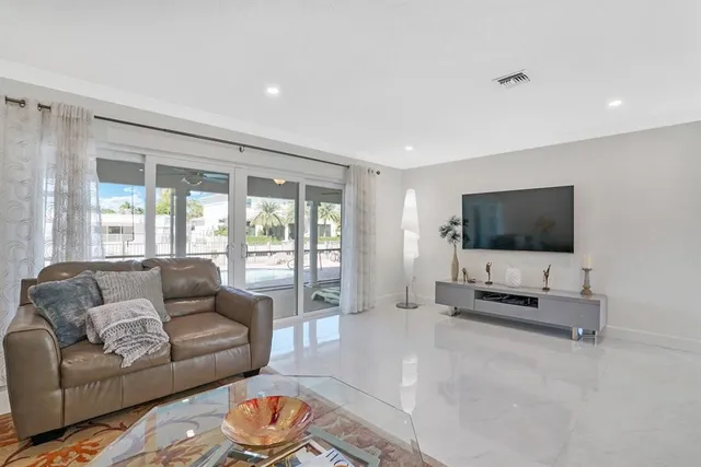 a kitchen with white cabinets stainless steel appliances and sink