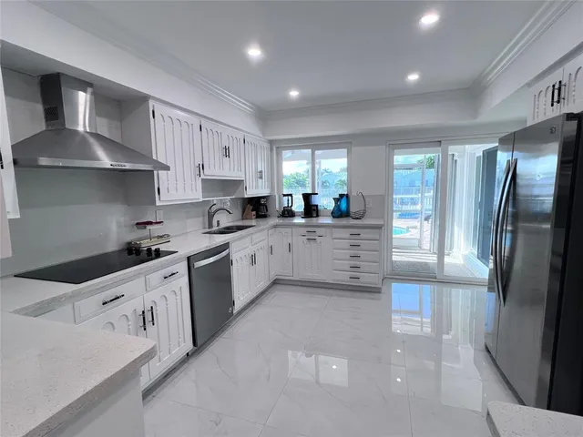 a spacious bedroom with a bed and a couch