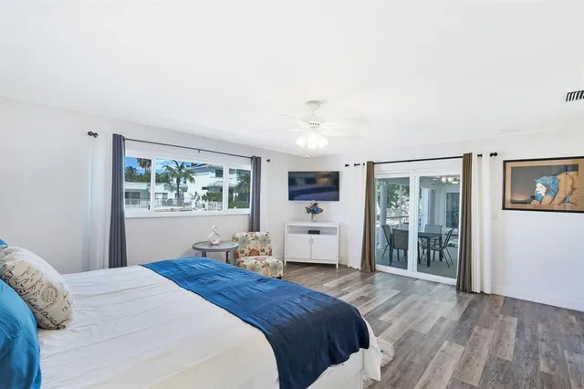 a bathroom with a granite countertop sink a toilet and a mirror
