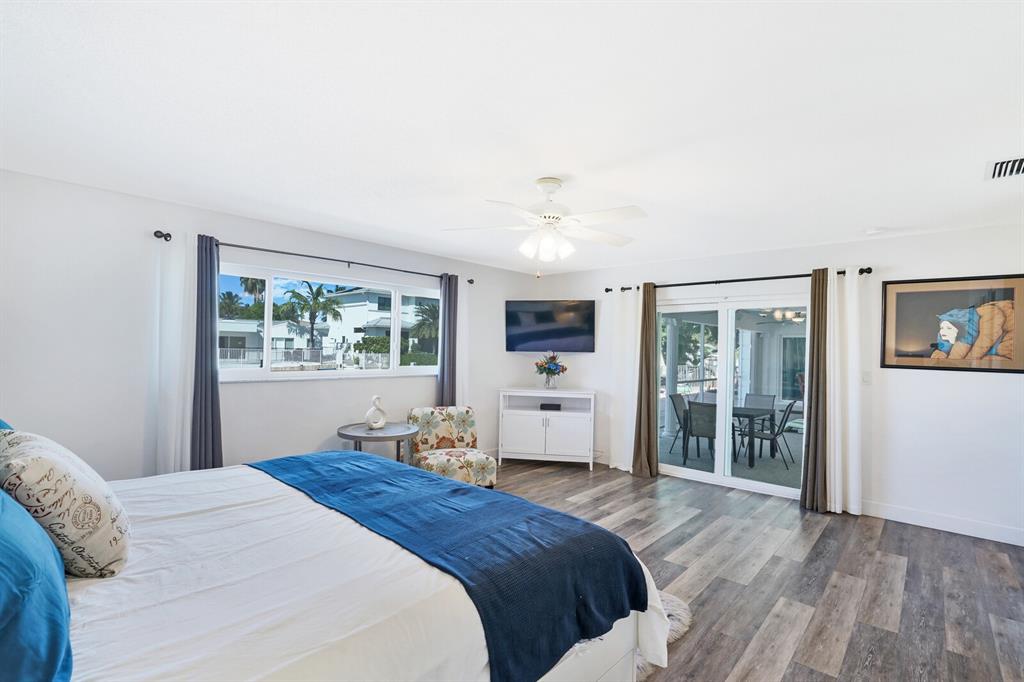 4101 Northeast 24th Avenue Lighthouse Point, FL 33064 - Photo 16 of 30 a bedroom with a large bed and a window