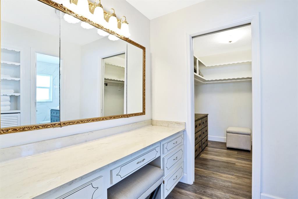 4101 Northeast 24th Avenue Lighthouse Point, FL 33064 - Photo 18 of 30 a bathroom with a sink and a mirror