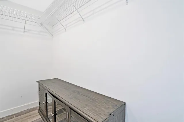 a bedroom with a bed and couch