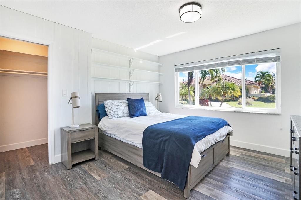 4101 Northeast 24th Avenue Lighthouse Point, FL 33064 - Photo 23 of 30 a bedroom with a bed and window