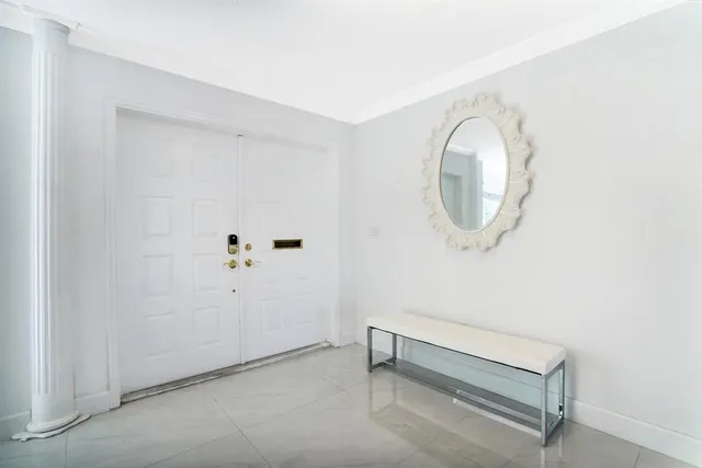 an empty room with mirror