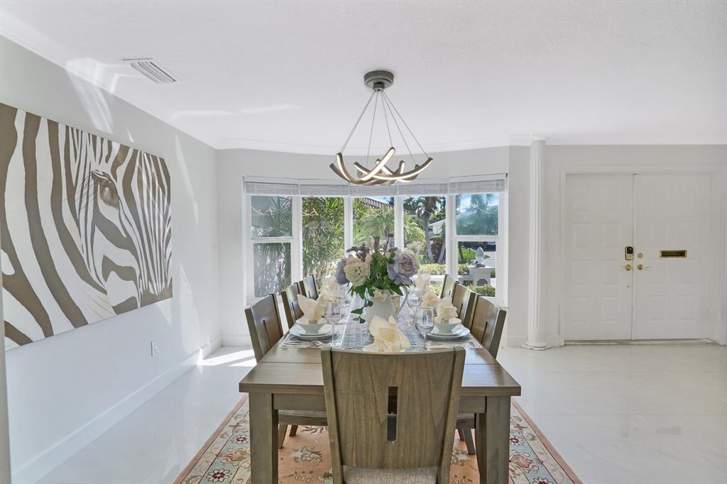 4101 Northeast 24th Avenue Lighthouse Point, FL 33064 - Photo 7 of 30 a view of a dining room with furniture window and outside view