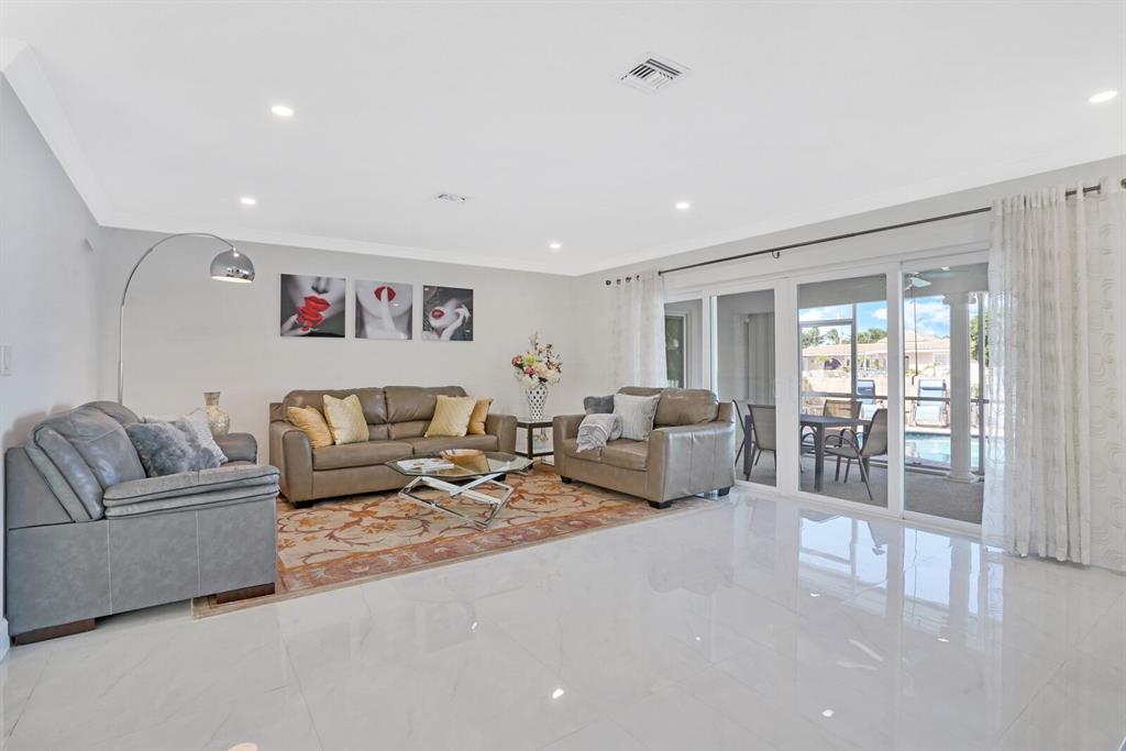 4101 Northeast 24th Avenue Lighthouse Point, FL 33064 - Photo 8 of 30 a living room with furniture and a large window