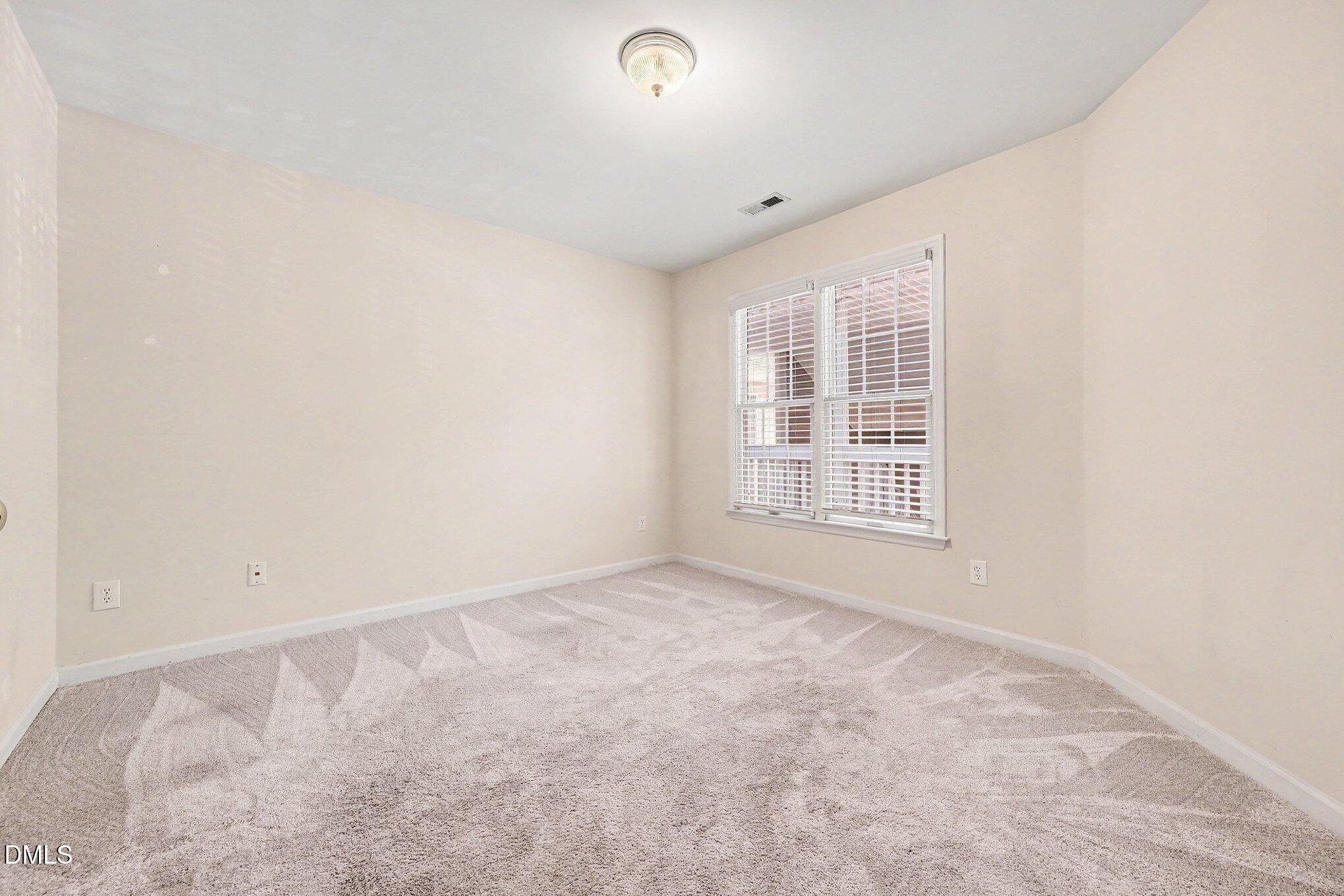 132 Springfork Drive Cary, NC 27513 - Photo 26 of 28 an empty room with windows