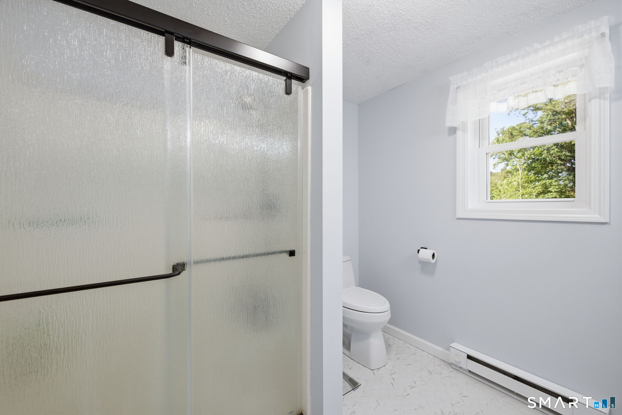 141 Hop River Road Coventry, CT 06238 - Photo 21 of 40 a bathroom with a granite countertop shower and a toilet